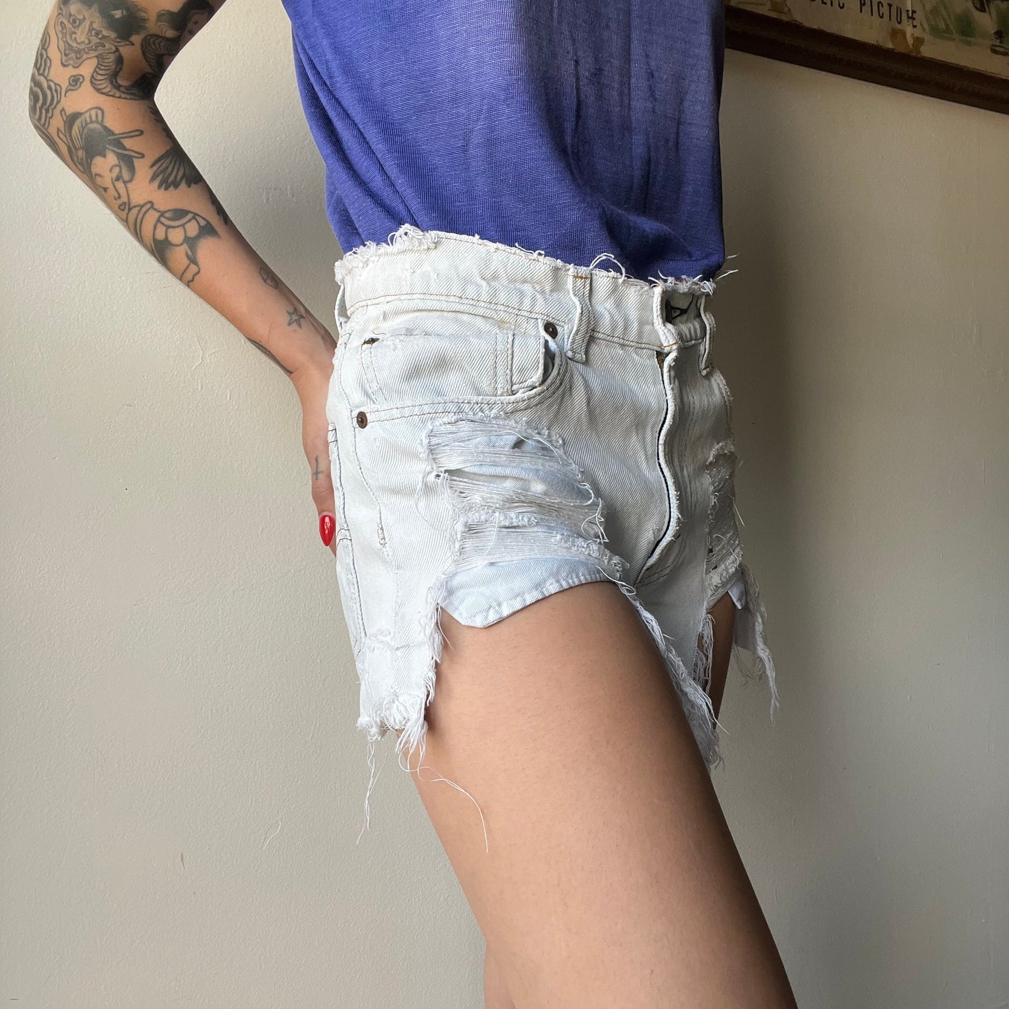 Vtg. Lightwash Thrashed Levi Shorts 30"W (women's 4)