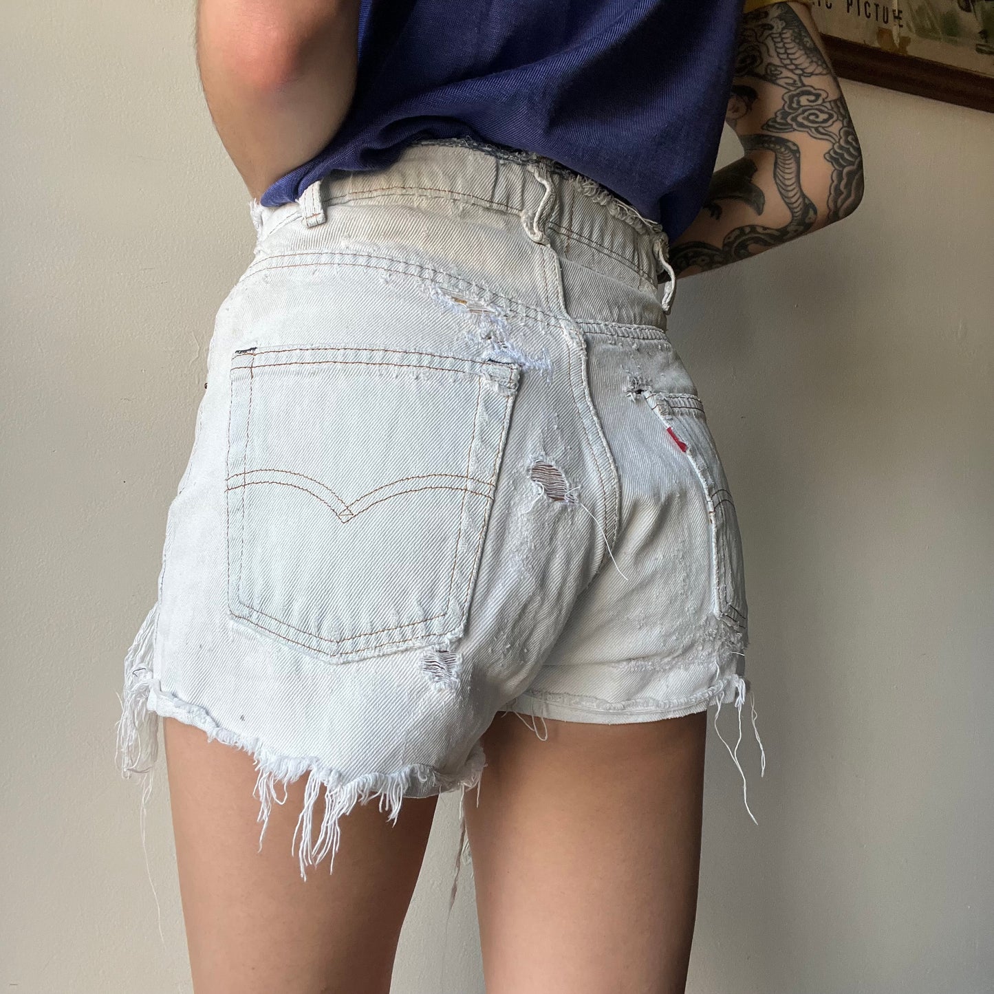 Vtg. Lightwash Thrashed Levi Shorts 30"W (women's 4)